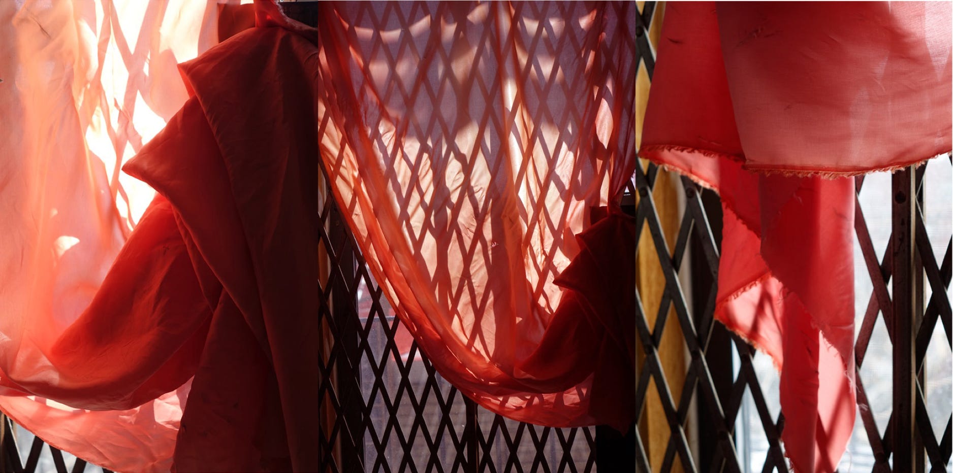 Window with a red curtain in the morning